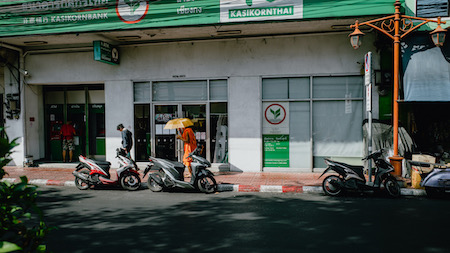 Orange monk in the green - Bangkok